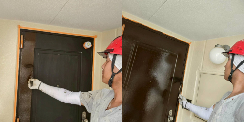 玄関ドアを丁寧に塗装する職人の作業風景